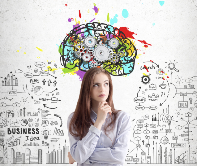 Portrait of a thoughtful young brunette woman in a purple shirt standing near a concrete wall with a colorful brain sketch with gears on top of it.